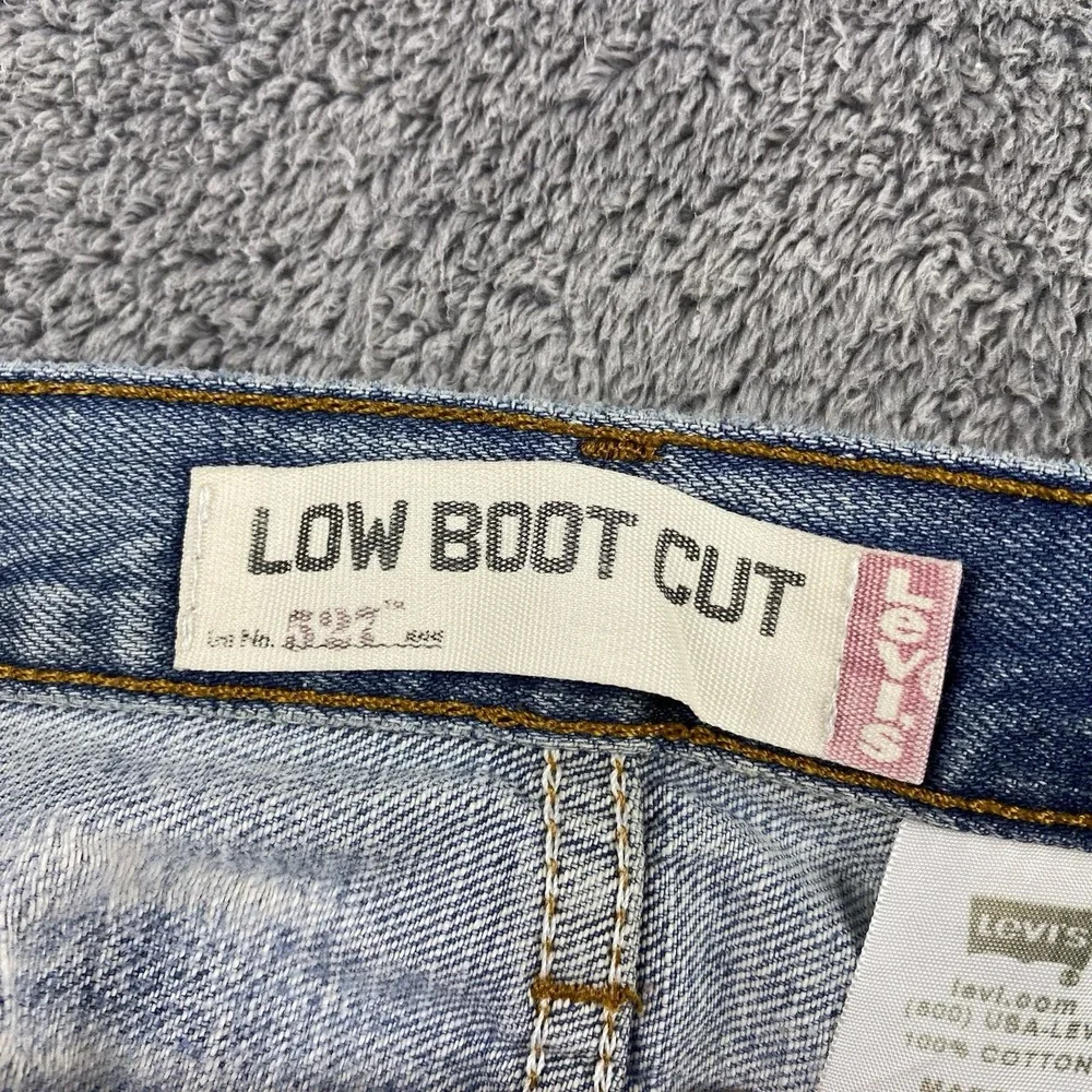 Levis 527 Low Boot Cut Jeans Mens 34x30 Blue Medium Wash Mid Rise Distressed Rip